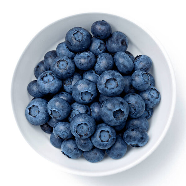 Fresh blueberries in bowl isolated on white. Top view.