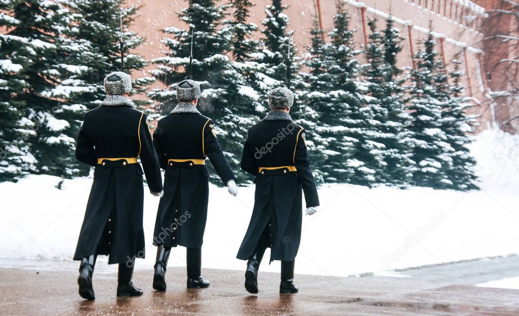 Changing the guard at the eternal fire. Kremlin wall. Winter