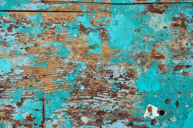 Soyma boya ile ahşap yüzey arka plan görüntüsü. Eski renkli ahşap tabure yakın çekim. Yüzey kırık tablo pitoresk doku.