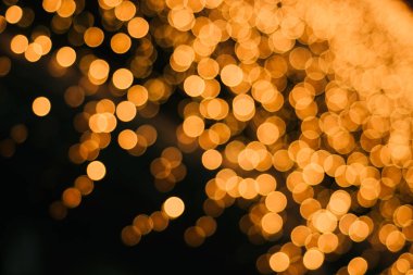 Siyah bir arka plan üzerinde Altın güzel bokeh.