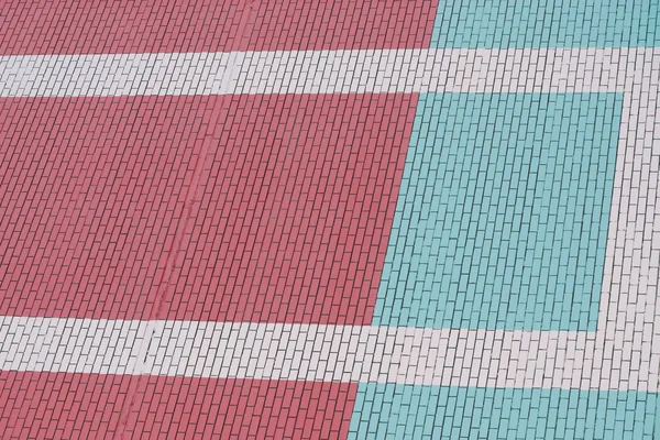白い線が付いているピンクとターコイズレンガの壁 壁近代的な建物クローズアップの背景 — ストック写真