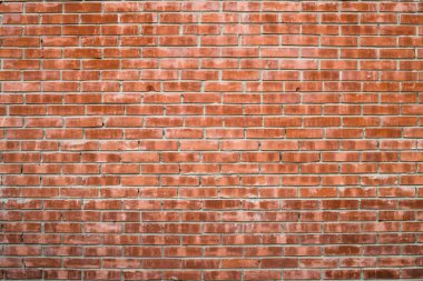 Farklı gölgeli kırmızı tuğladan yapılmış eski gerçekçi tuğla duvar. Kahverengi pürüzsüz tuğla.