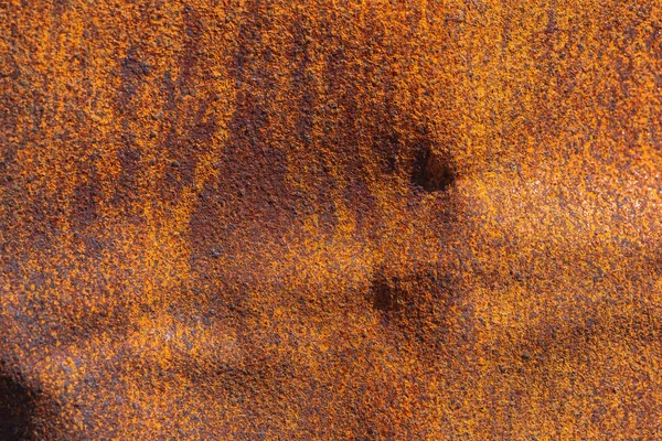 Rust on metallic surface. Rusted iron texture. Rusty metal background with copy space. Rough oxide plate close up. Strong rust. Hard decay of metal in macro. Oxidation of steel. Chemical reaction.