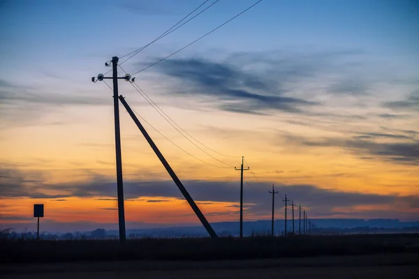 Power Lines Field Sunrise Background Silhouettes Poles Wires Dawn Cables — Stock Photo, Image