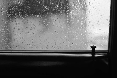 Car glass with drops of rain with copy space