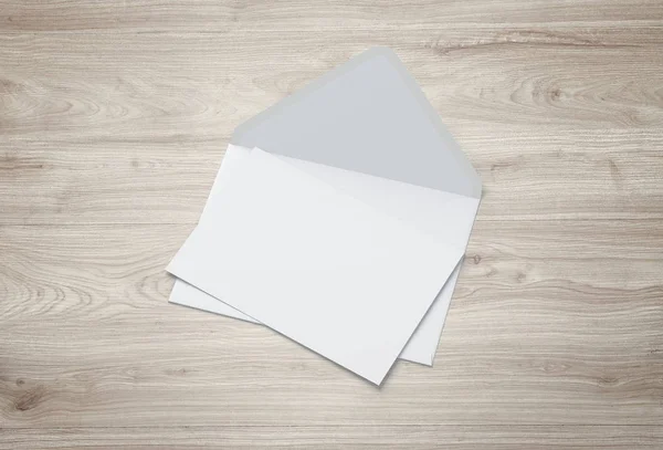 White envelope and post card on a background.