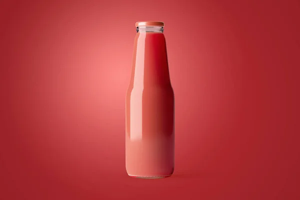 Juice glass bottle without label template for you design. Fruit beverage mockup on background. A bottle of natural juice drink.