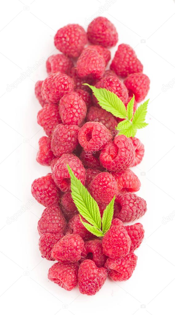 Raspberry with leaves isolated on white background