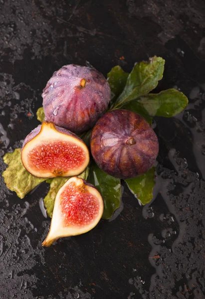 Fresh figs on black background close up — Stock Photo, Image