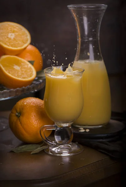 Glass of fresh orange juice with fresh fruits on wooden — Stock Photo, Image