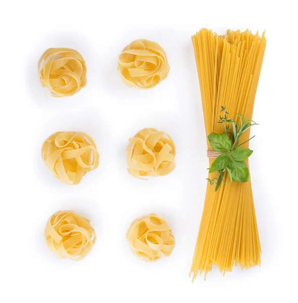 Various Raw Uncooked Fettuccine Nests Spaghetti White Background — Stock Photo, Image