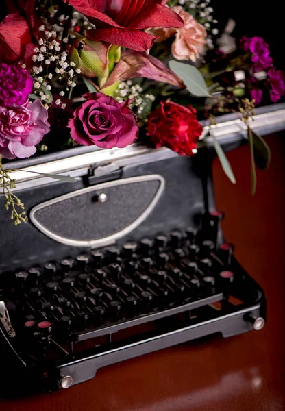 vintage typewriter with flowers