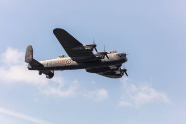 SADDLEWORTH, UK - August 11, 2018: Lancaster Bomber memorial flight at WW2 day. clipart