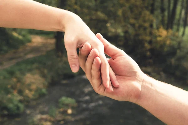 Mans Hand Gently Holding Female Background Spring Stream Concept Love — Stock Photo, Image