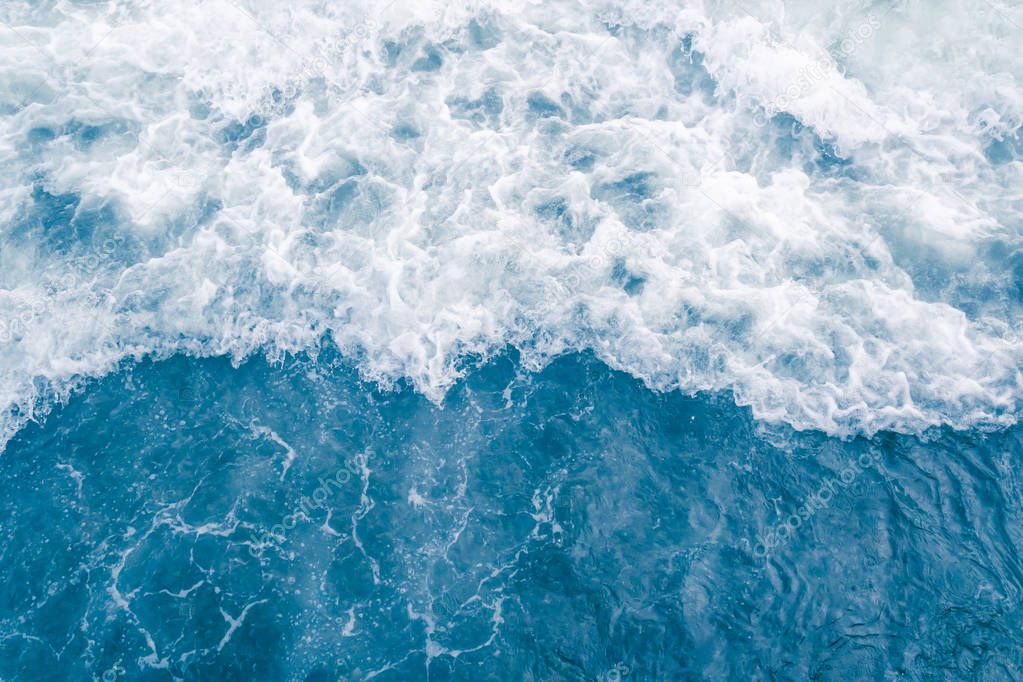 Pale blue sea wave during high summer tide, abstract ocean backg