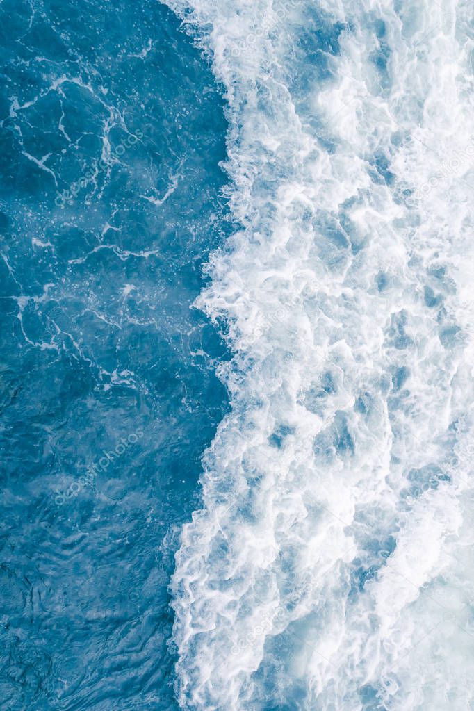 Pale blue sea wave during high summer tide, abstract ocean backg