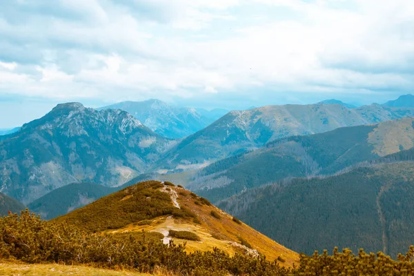 Beautiful autumn mountain landscape, against the blue sky