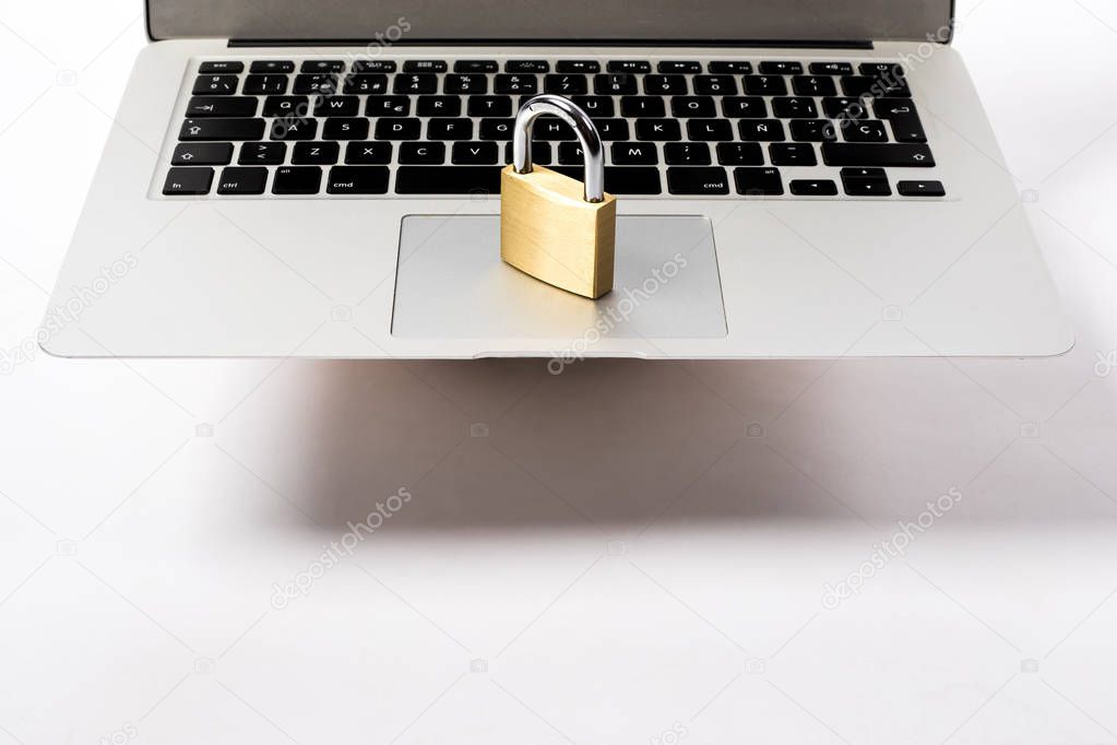 golden padlock on a laptop