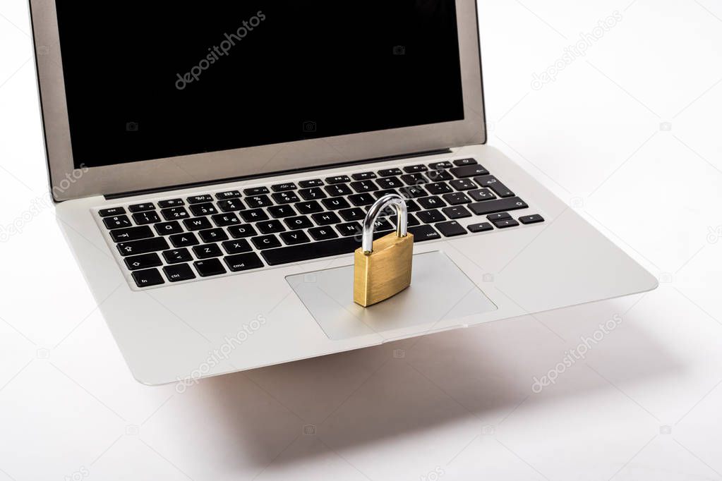 golden padlock on a laptop