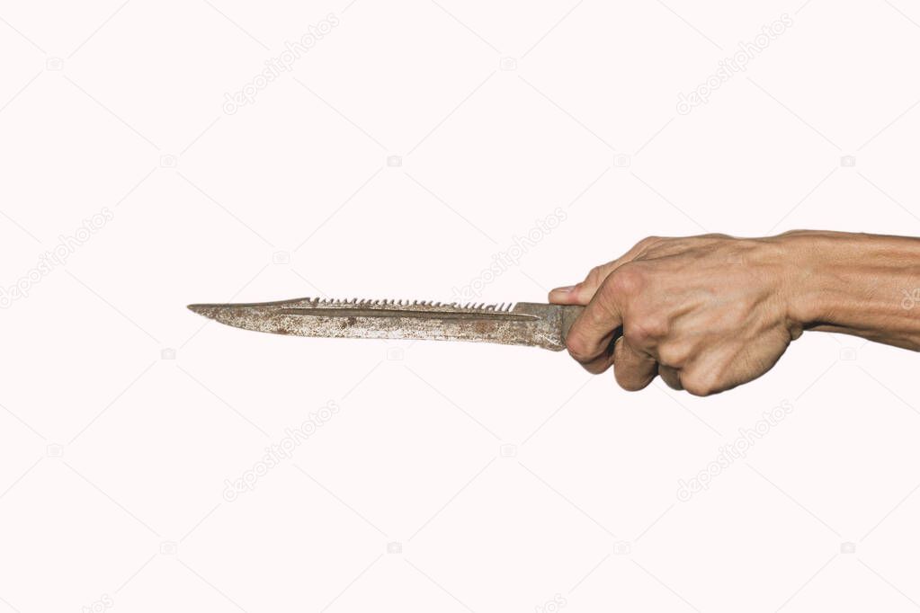 Old rusty knife in the hand of an adult on a white background