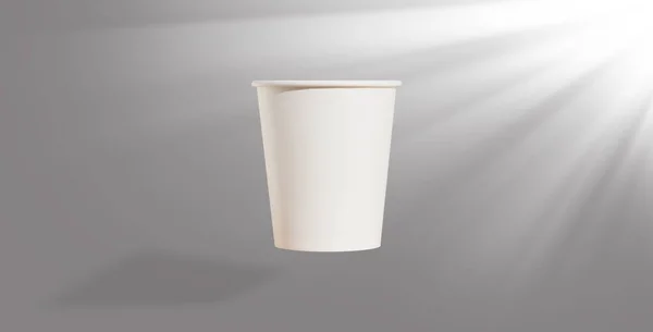 White disposable Cup made of thick paper on a uniform background . The sun\'s rays are shining