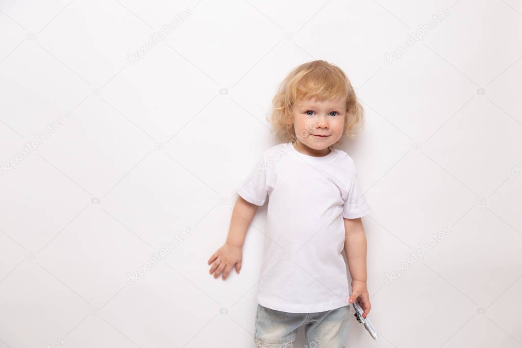 child playing with toy airplane against on a white background. concept dreams of flight