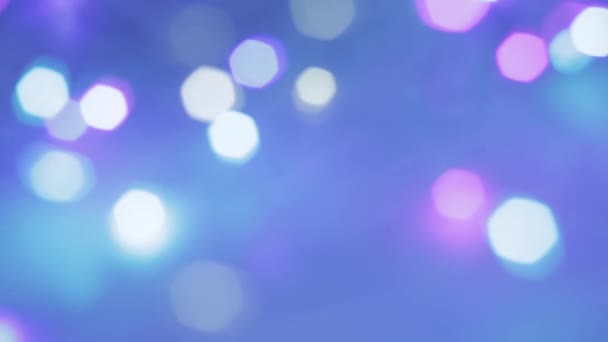 Moving bokeh blue glitter lights, defocused light reflections background. Christmas bokeh in blue colors — ストック動画