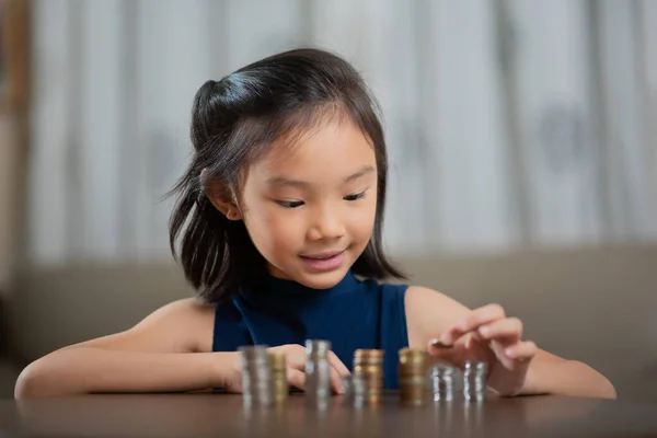 Asian girl, managing finances, counting money