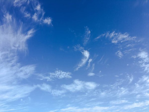Beautiful clouds against a blue sky background. Blue sky with cloudy weather, nature cloud. White clouds, blue sky and sun