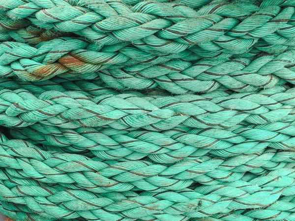 Nautical rope, closeup background texture, vintage toned. Rough rope background, boat rope