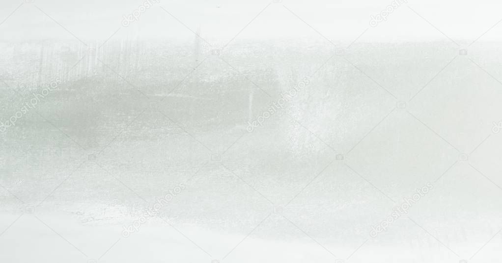 White washed painted textured abstract background with brush strokes in gray and black shades