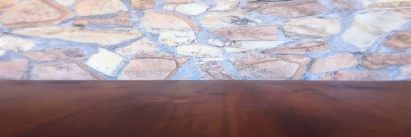 Fondo de pared de piedra y mesa de madera de roble viejo desgastado. Mesa de madera marrón — Foto de Stock