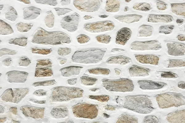 old stone wall background, seamless ashlar stone wall texture.
