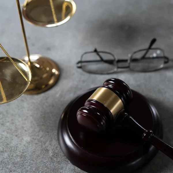 wooden gavel and eyeglasses, justice and law concept