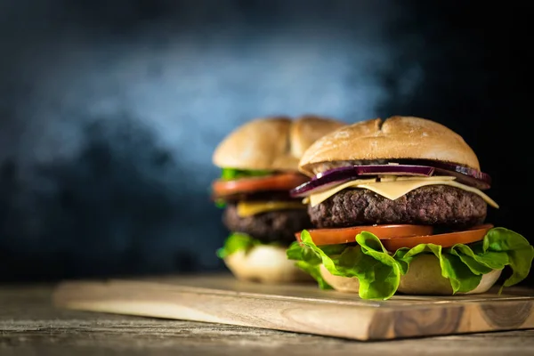 Two Fresh Tasty Cheeseburgers Wooden Board Fast Food Concept — Stock Photo, Image