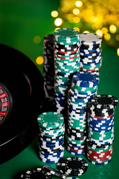 casino background, poker chips on gaming table, roulette wheel in motion