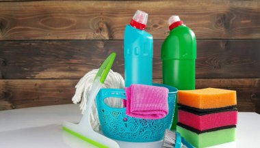 Home cleaning concept. Various Cleaning Products, place for typography clipart
