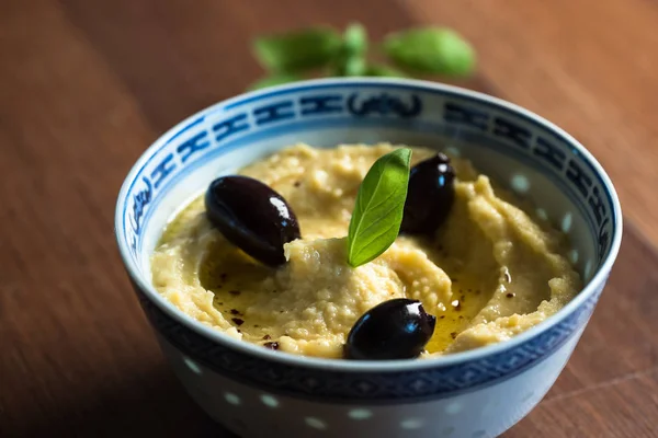 Hummus Olives Pepper Plate Traditional Levantine Dip Basil Leaves Table — Stock Photo, Image