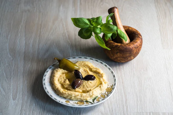 Hummus Olives Pepper Plate Traditional Levantine Dip Basil Leaves Wooden — Stock Photo, Image