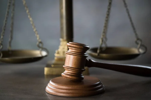 Huge judge's wooden gavel on blurred background