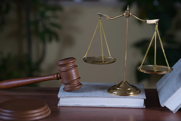 Huge judge's wooden gavel on blurred background