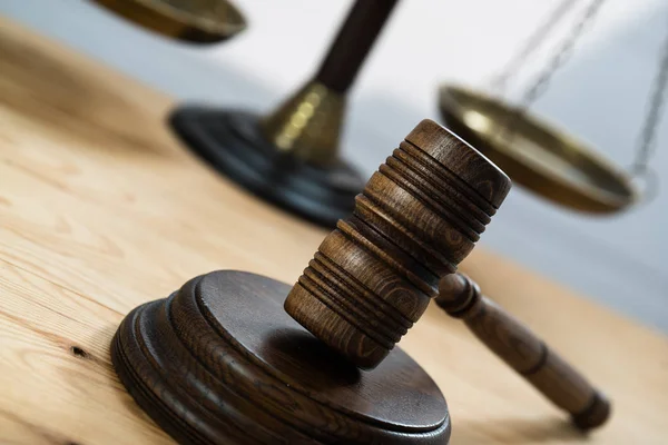 Huge judge\'s wooden gavel on blurred background