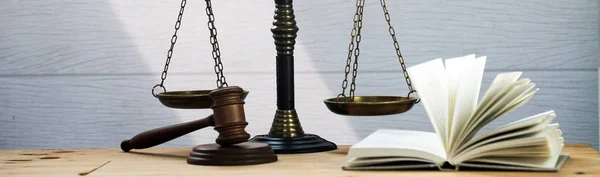 Huge judge\'s wooden gavel on blurred background