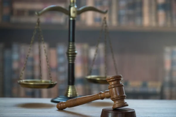 Huge judge\'s wooden gavel on blurred background