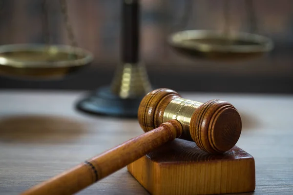 Huge judge\'s wooden gavel on blurred background