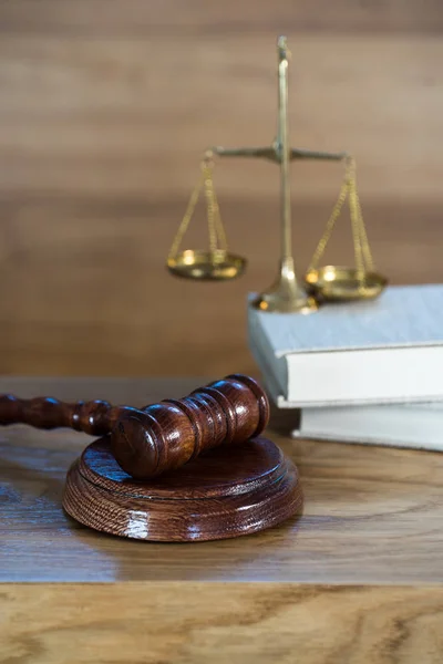 Huge judge\'s wooden gavel on blurred background