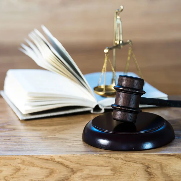 Huge judge\'s wooden gavel on blurred background