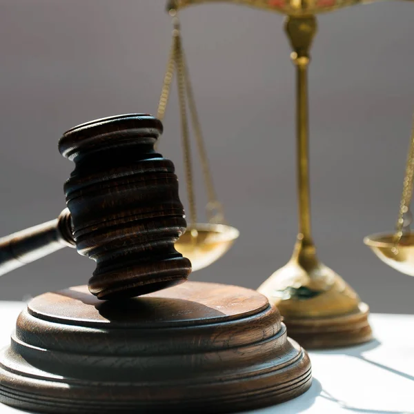 Huge judge\'s wooden gavel on blurred background