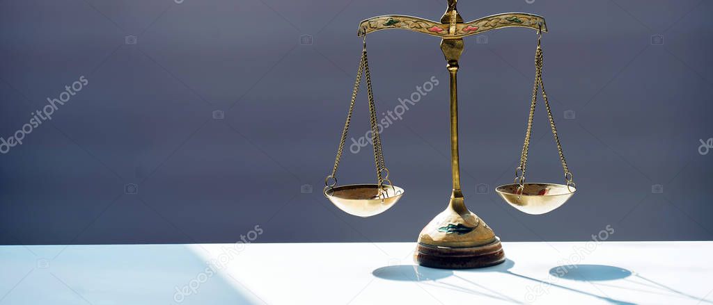 Themis scales isolated on blurred background