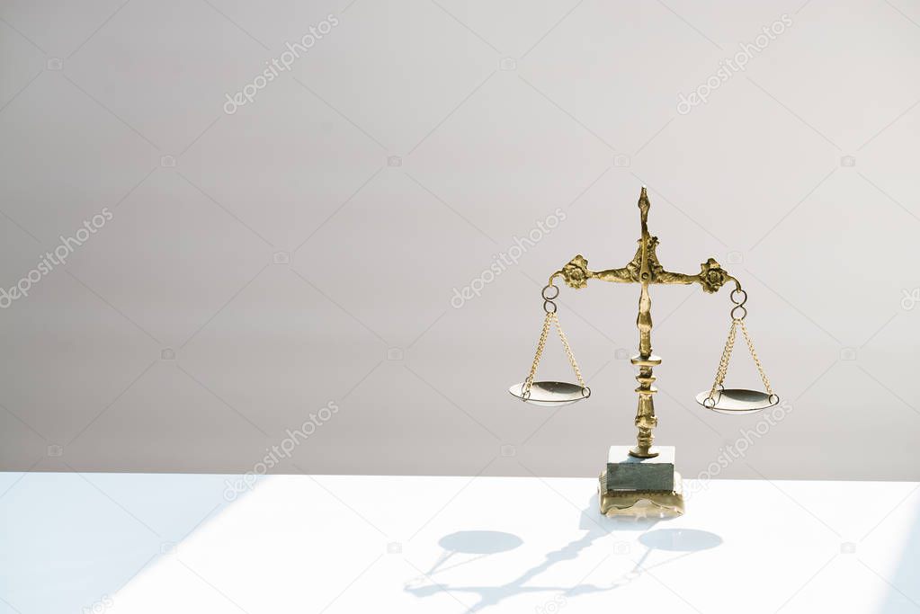 Themis scales isolated on blurred background